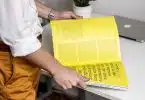 person holding book